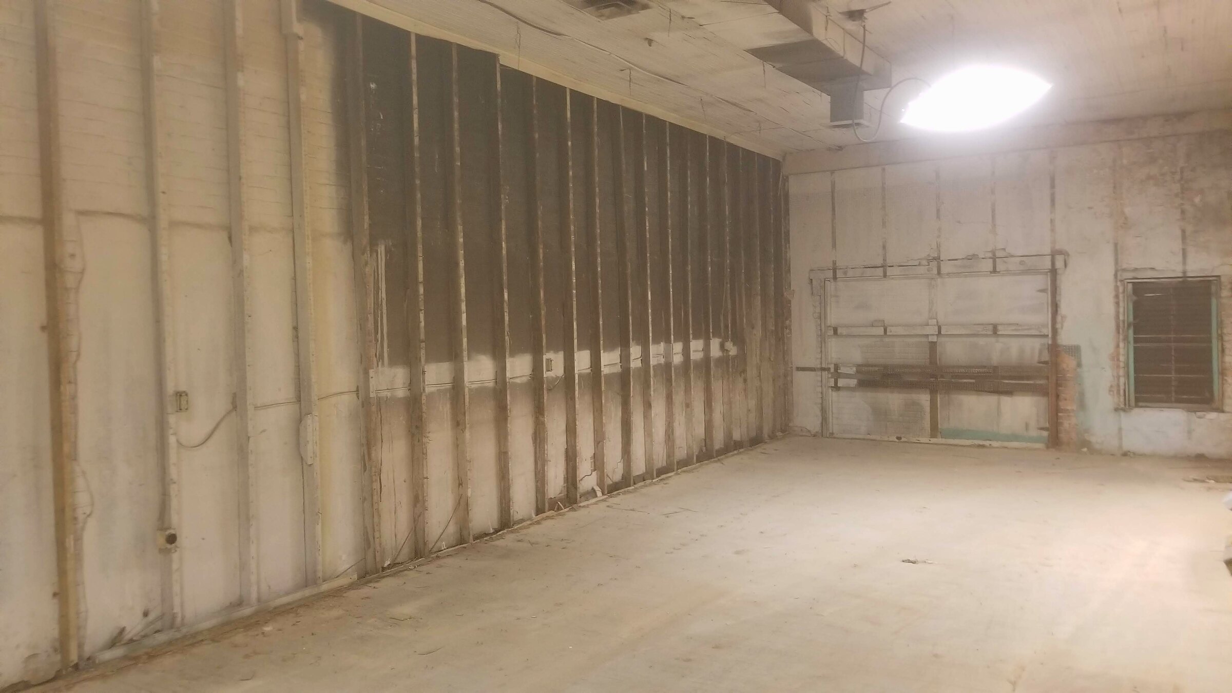 Exposed masonry and original walls inside the office renovation