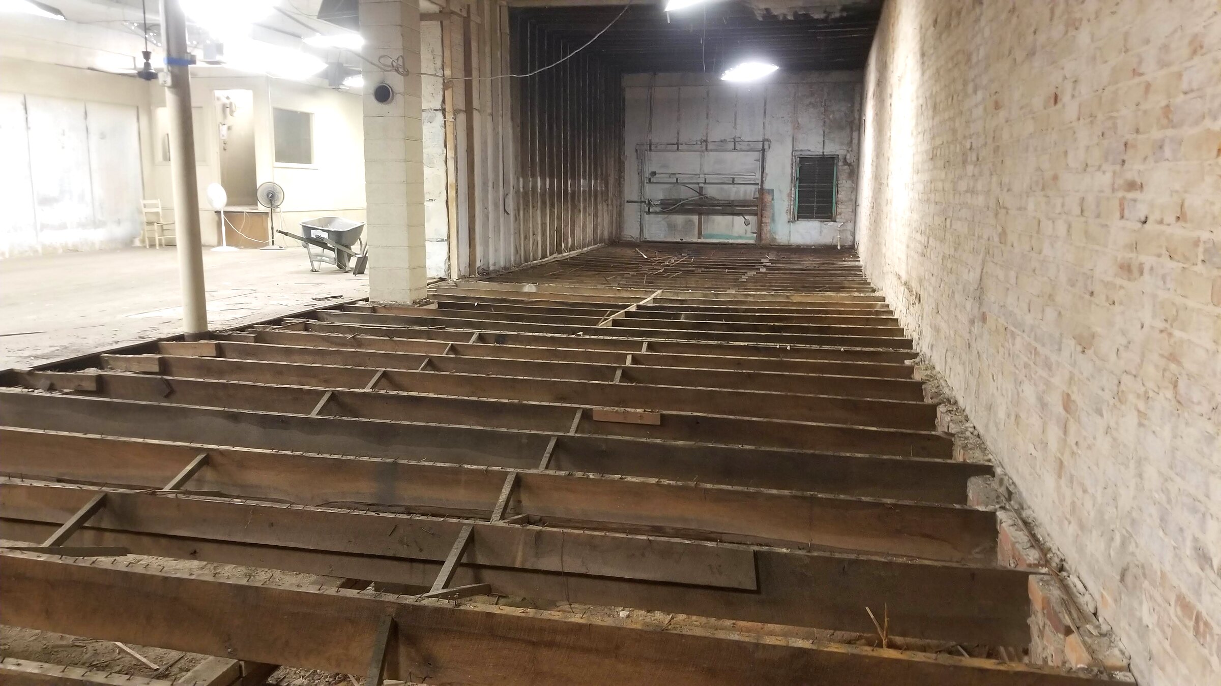 Long run of exposed floor joists during structural renovation